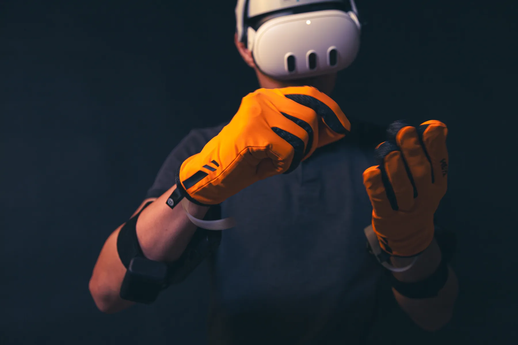 A HEXR wearer making a fist, with no cables attached